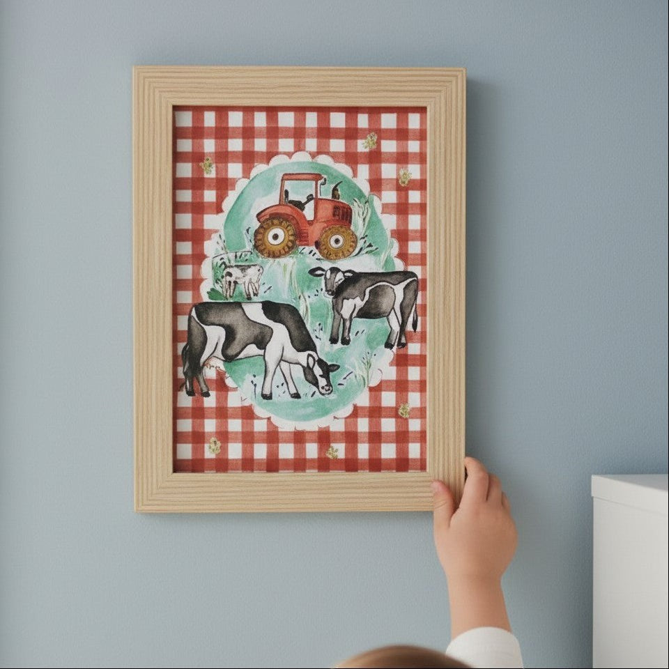 School Bus Studio A4 farm print featuring cows and a tractor on red gingham background in an oak finish frame.