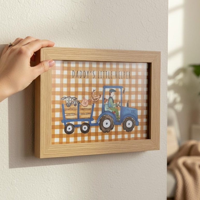 School Bus Studio Daddy's Little Helper A4 print in oak frame featuring a blue tractor and farm animals on gingham.