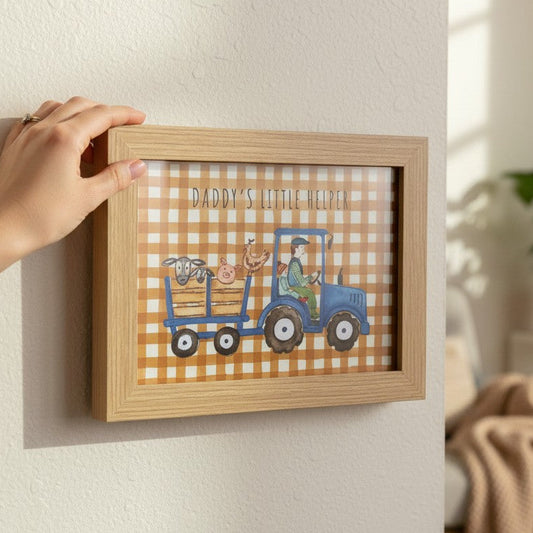 School Bus Studio Daddy's Little Helper A4 print in oak frame featuring a blue tractor and farm animals on gingham.