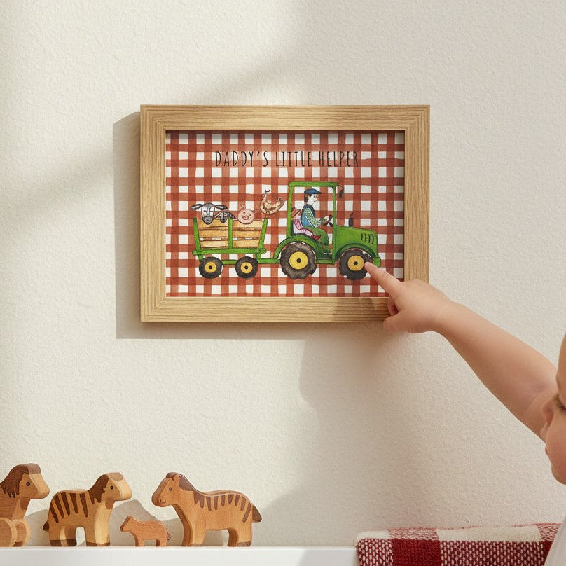 School Bus Studio Daddy's Little Helper green tractor A4 art print in an oak frame on a nursery wall.